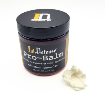 Pro-Balm for Tattoo Artists with product outside of container - Ink Defense