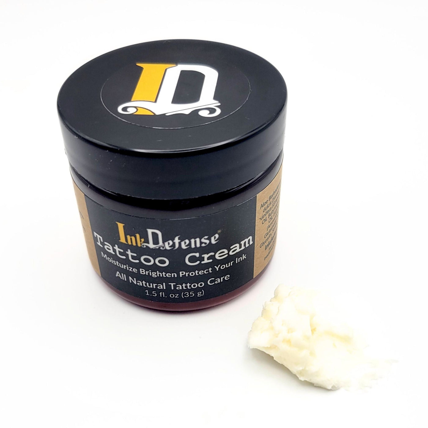 Tattoo Cream for tattoo aftercare with cream outside of container - Ink Defense